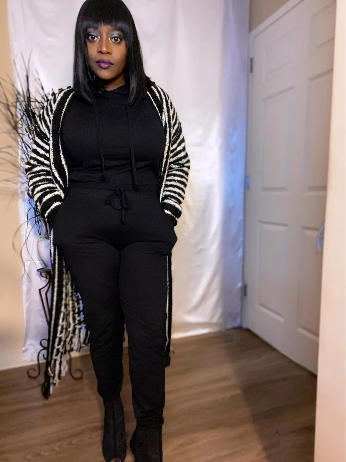 Black hooded sweatsuit